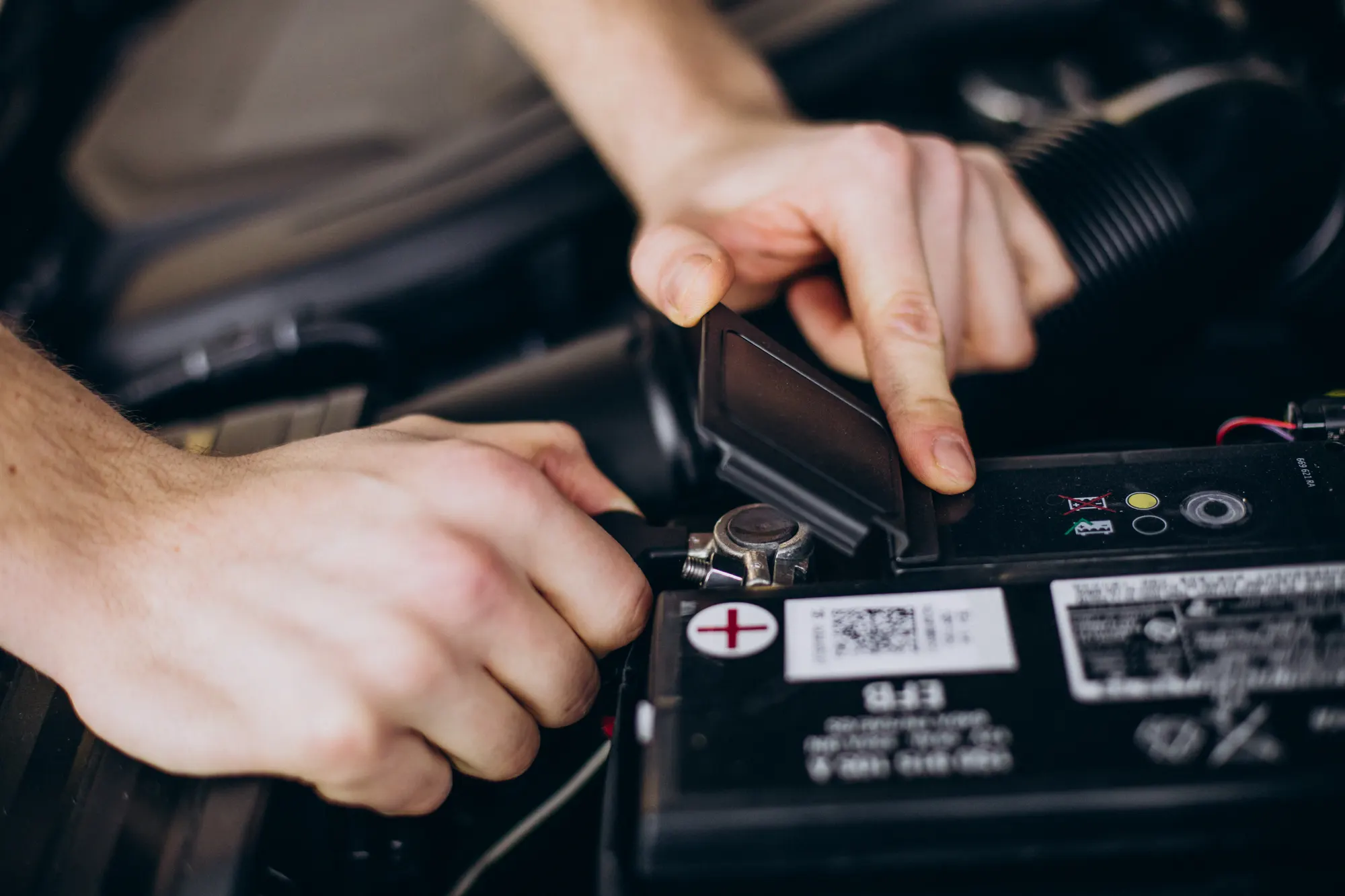 Battery and charging system being tested on a European car